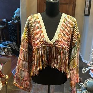 Unusual loose weave short sweater in multi colors with fringe around bottom. NWT